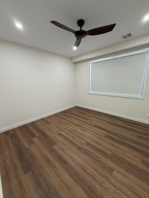 Bedroom with timber flooring